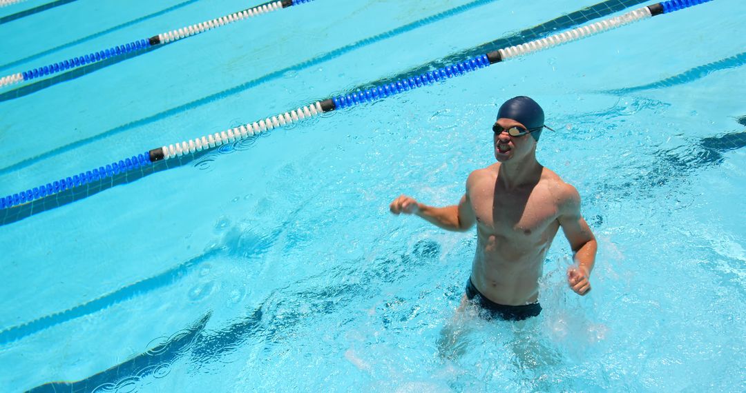 Male Swimwear Wearing Cap and Goggles Relaxing in Pool - Free Images, Stock Photos and Pictures on Pikwizard.com