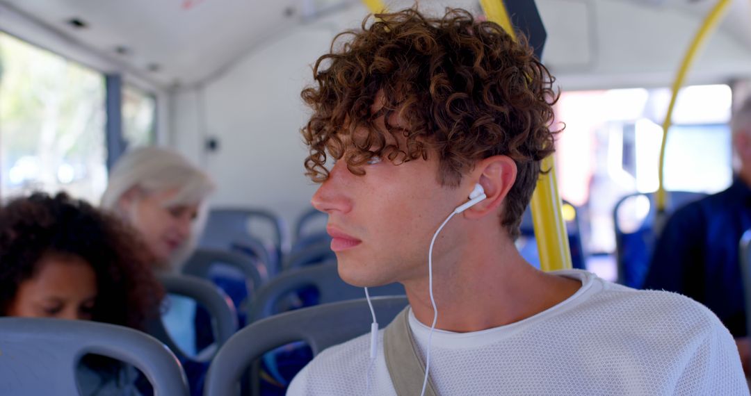 Young Man Listening to Music on Public Transportation - Free Images, Stock Photos and Pictures on Pikwizard.com