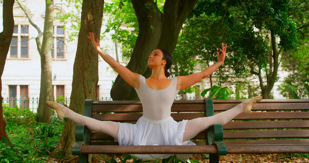 Ballet Dancer Performing Split on Park Bench - Free Images, Stock Photos and Pictures on Pikwizard.com