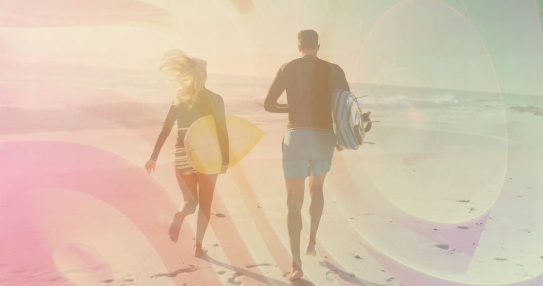 Energetic Couple Running on Beach Carrying Surfboards With Sunlight Glow