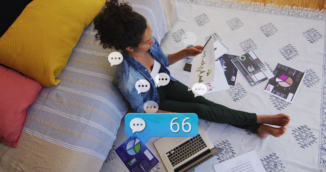 Senior Professional Analyzing Graphs and Data at Home