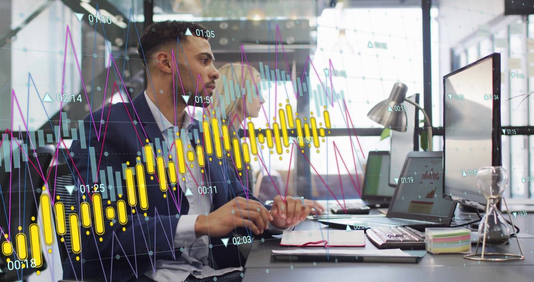 Businesspeople Analyzing Financial Data on Computers in Office