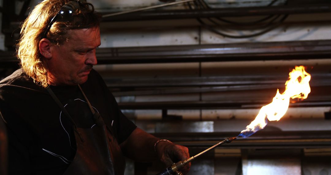 Metalworker Using Blow Torch in Workshop - Free Images, Stock Photos and Pictures on Pikwizard.com