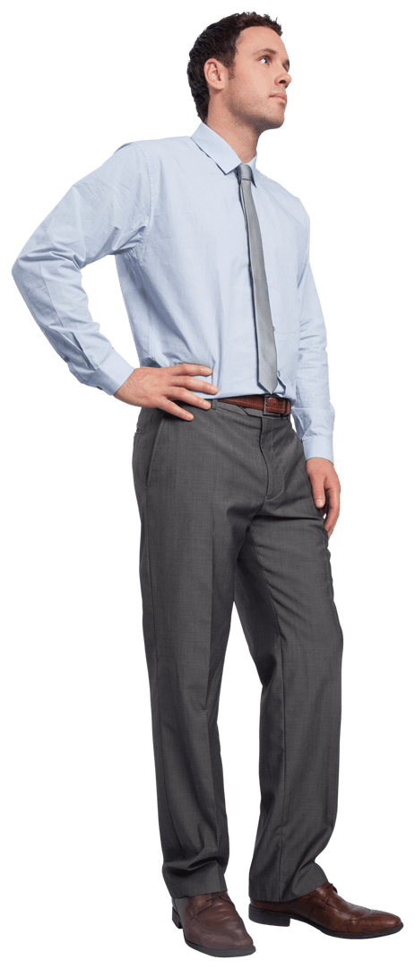 Confident Businessman Standing with Hand on Hip in Gray Suit