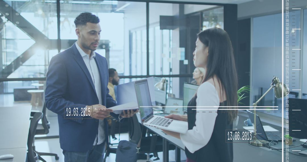 Diverse Professionals Utilizing Technology in Modern Office