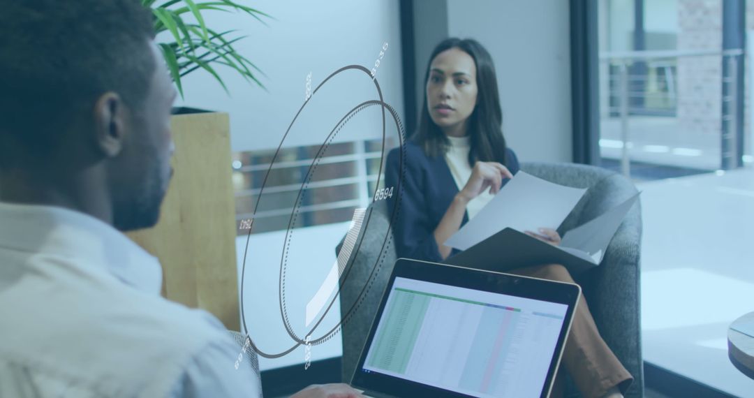 Business Professionals Analyzing Data in Open Office Space