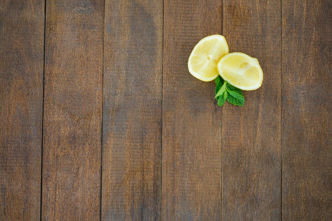Lemon wedges and mint on wooden board - Free Images, Stock Photos and Pictures on Pikwizard.com
