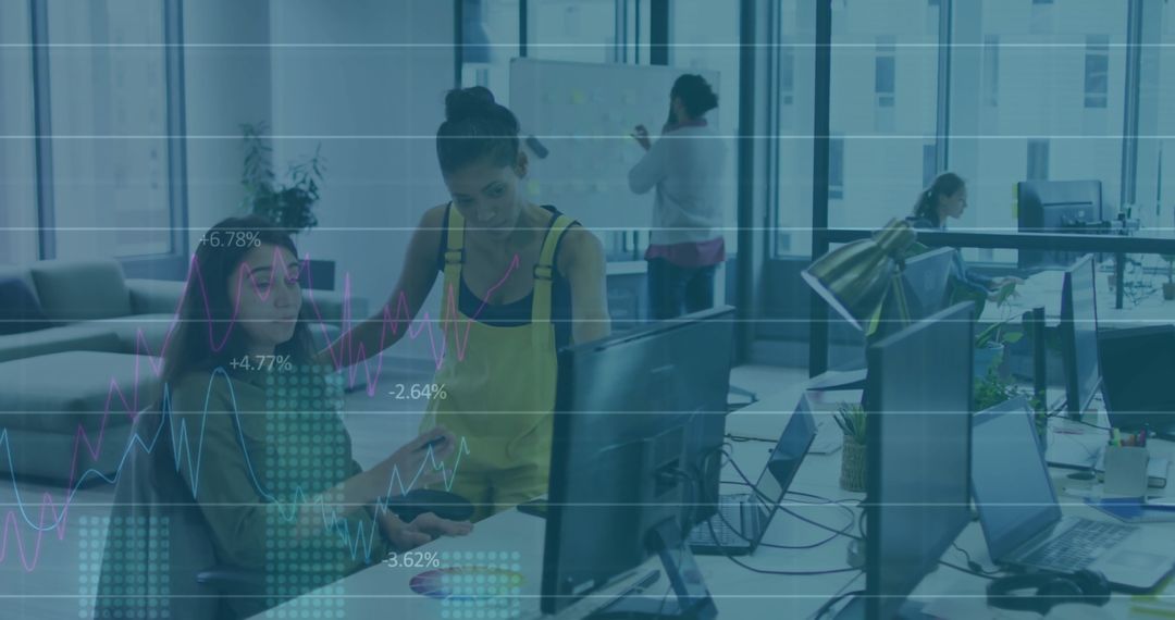 Team Collaboration in Open-Plan Office with Dual Monitors