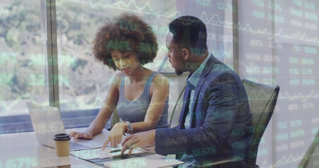 Professional Coworkers Analyzing Financial Data in Modern Office