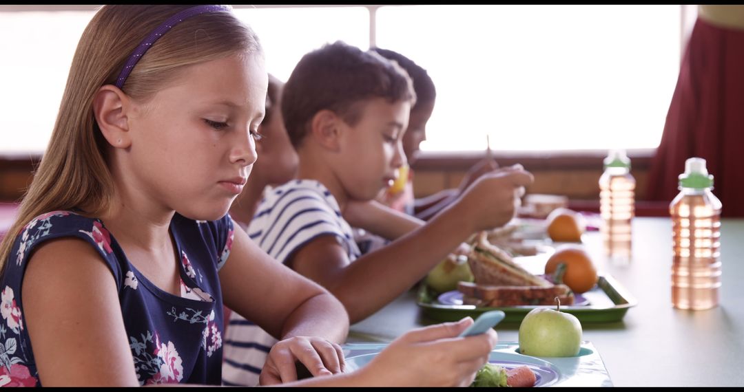 School Children Having Breakfast in Cafeteria Row