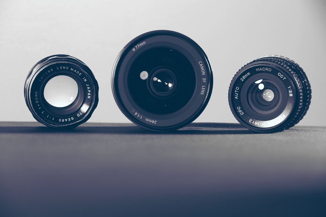 Close-Up of Three Camera Lenses on Grey Background - Free Images, Stock Photos and Pictures on Pikwizard.com