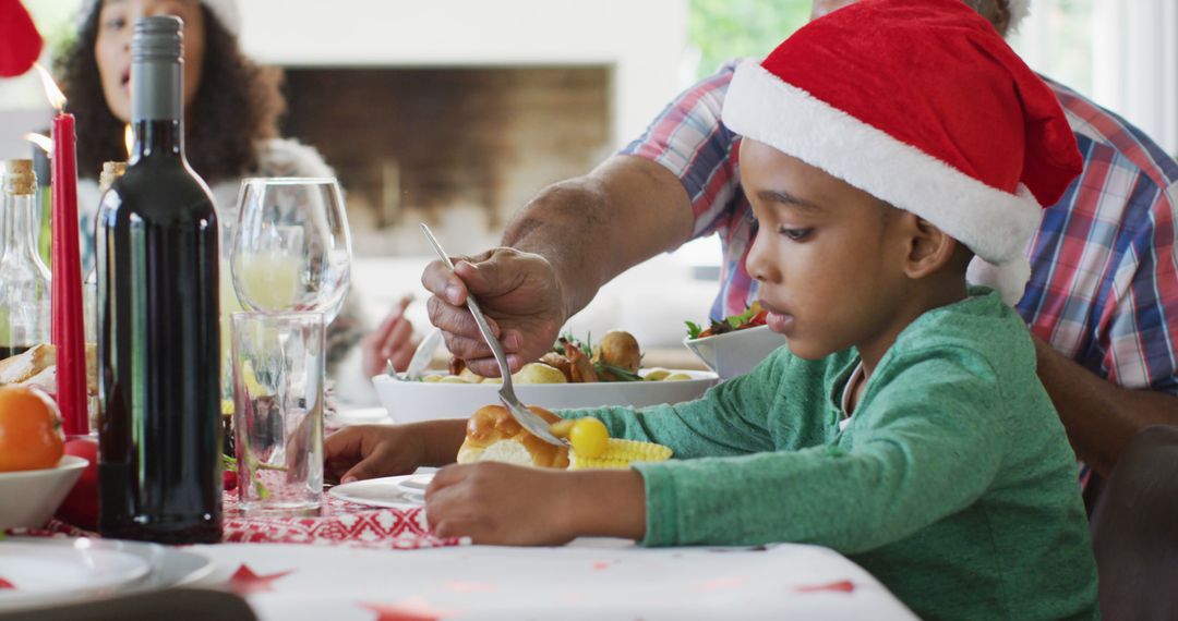 African American Child Enjoying Christmas Meal with Family - Free Images, Stock Photos and Pictures on Pikwizard.com