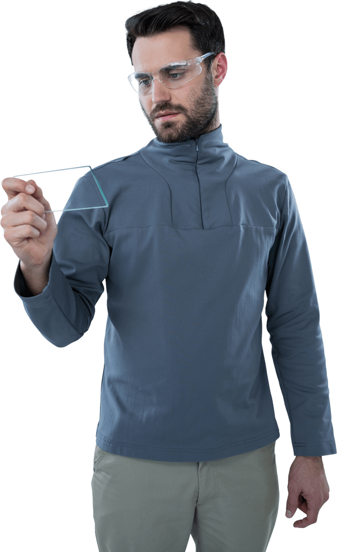 Man Examining Transparent Mobile Device with Protective Eyewear
