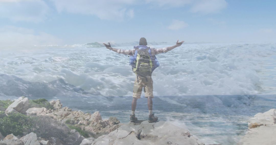 Hiker Embracing Freedom on Scenic Coastal Cliff