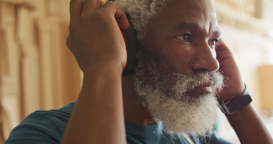 Close-up of Bearded Senior Man Listening to Music with Headphones - Free Images, Stock Photos and Pictures on Pikwizard.com