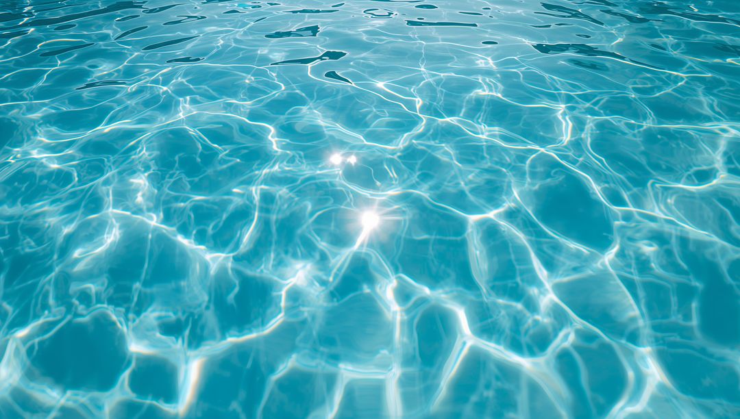 Sunlit Turquoise Pool Water with Rippling Reflections