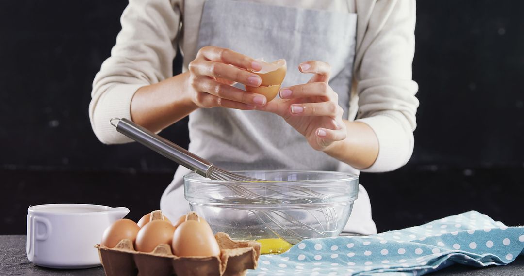 Person Cracking Egg into Bowl While Cooking in Kitchen - Free Images, Stock Photos and Pictures on Pikwizard.com