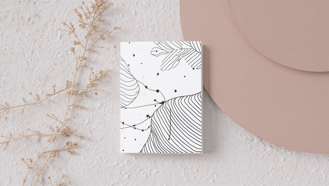 Minimalist Botanical Line Art Booklet on Textured Plaster with Dried Sprig and Dusty Pink