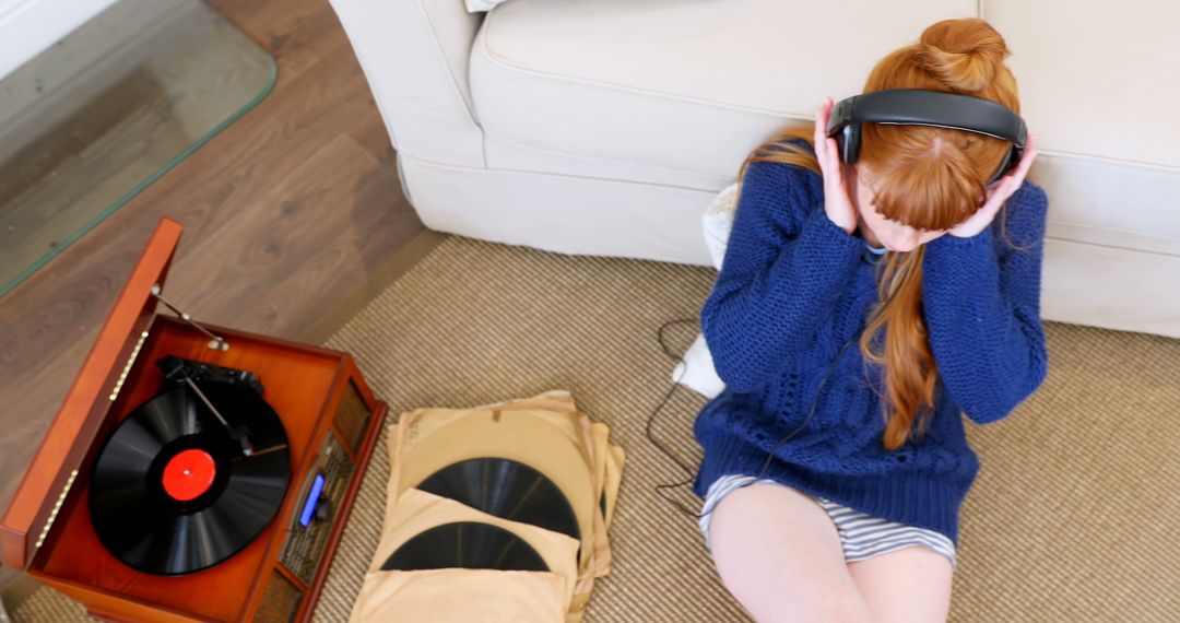 Young Woman Enjoying Vinyl Records at Home - Free Images, Stock Photos and Pictures on Pikwizard.com