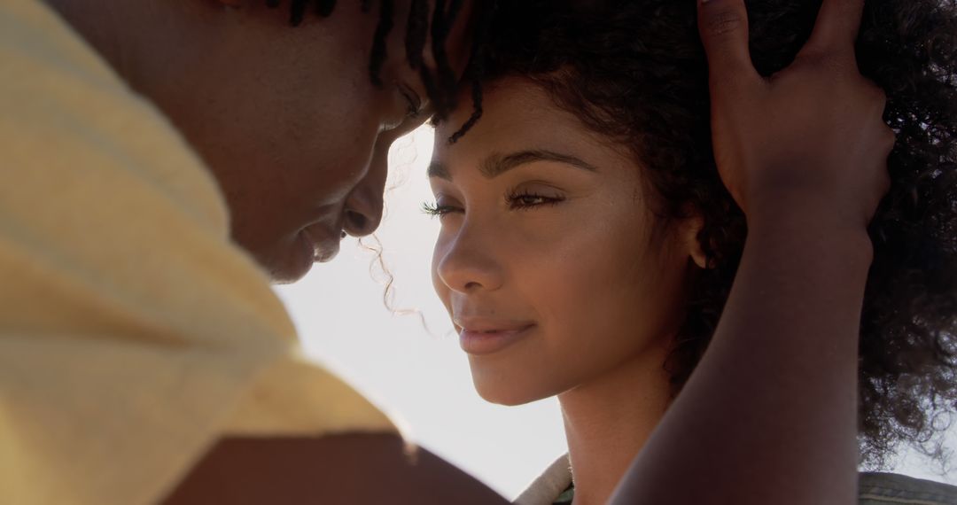 Couple Embracing on Sunny Beach Day