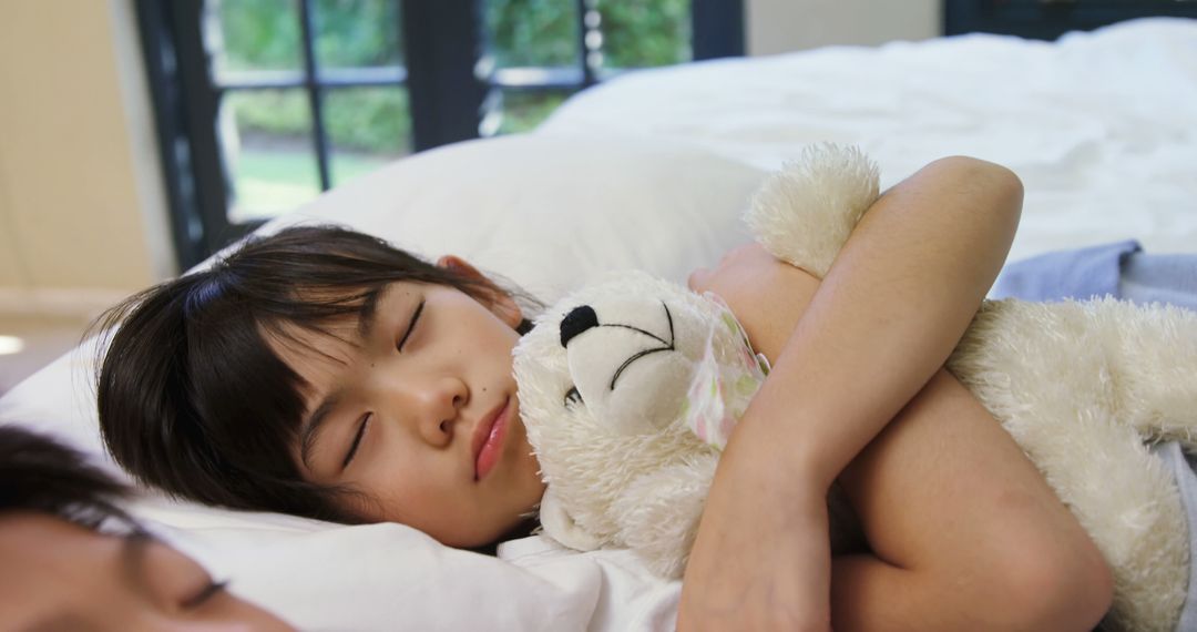 Peaceful Young Girl Sleeping Hugging Plush Toy in Cozy Bedroom - Free Images, Stock Photos and Pictures on Pikwizard.com