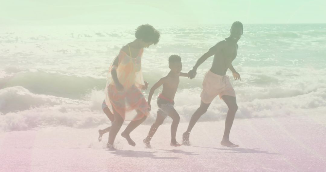 Family Enjoying Time at the Beach Against Ocean Waves