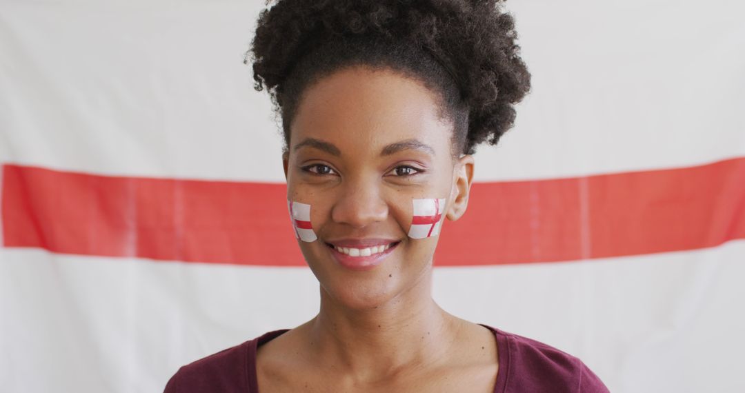 Young African Woman with England Flag Face Paint Smiling - Free Images, Stock Photos and Pictures on Pikwizard.com