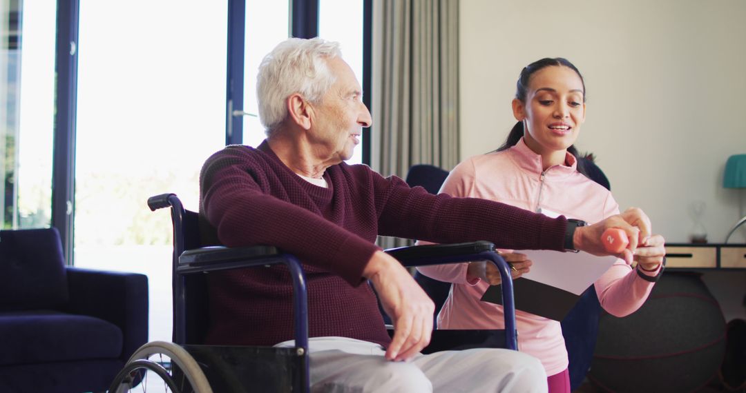 Elderly man exercising with assistance of personal trainer in home environment - Free Images, Stock Photos and Pictures on Pikwizard.com