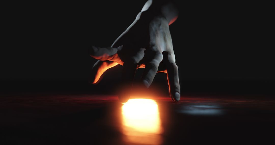 Emerging Hand with Glowing Light in Darkness