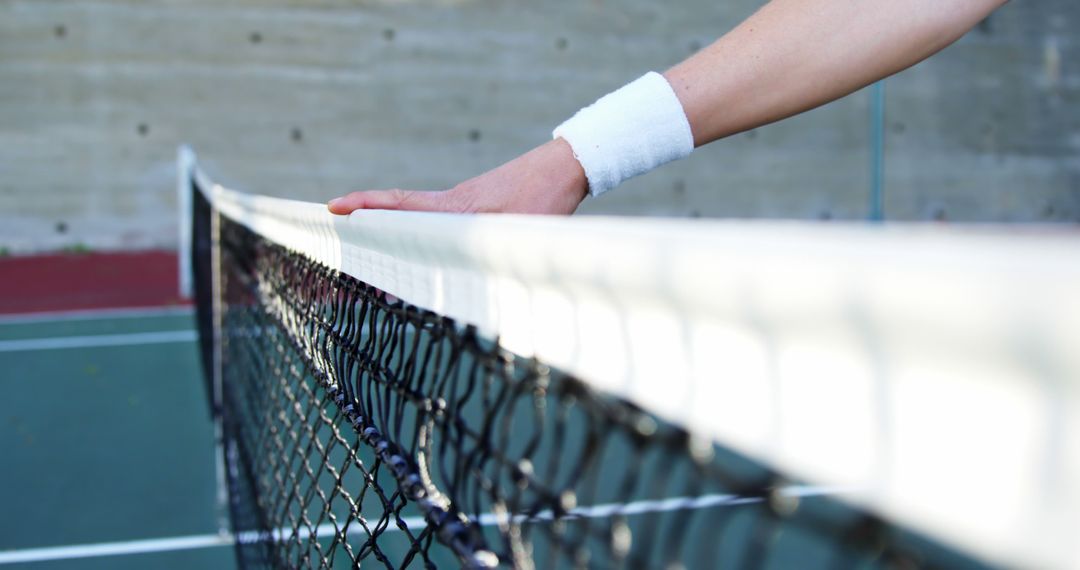 Tennis Player Hand Touching Net Outdoors - Free Images, Stock Photos and Pictures on Pikwizard.com