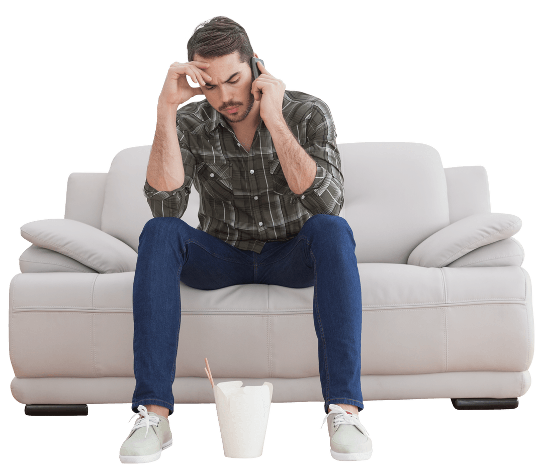 Confused Man on Phone Sitting on Transparent Sofa