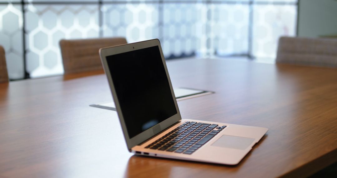 Open Laptop on Wooden Conference Table in Modern Office - Free Images, Stock Photos and Pictures on Pikwizard.com