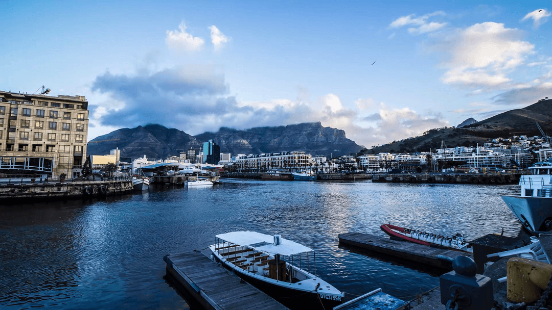 Scenic Harbor Breathtaking at Dusk with Transparent Waters and Mountain Views