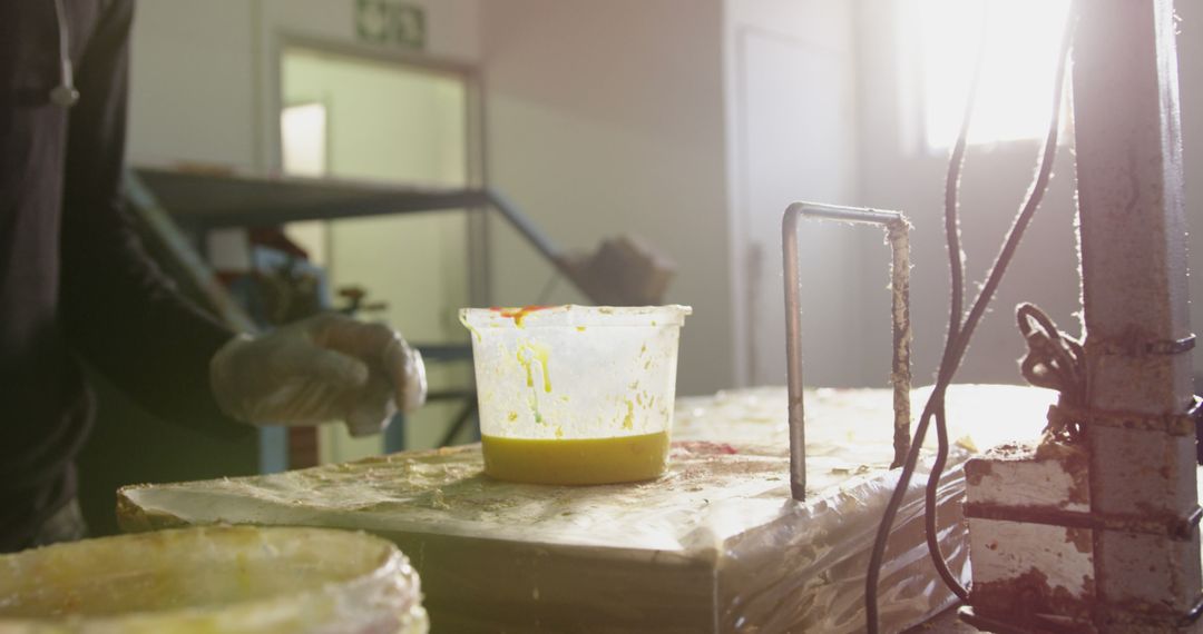 Worker Handling Chemical Mixture in Industrial Setting - Free Images, Stock Photos and Pictures on Pikwizard.com