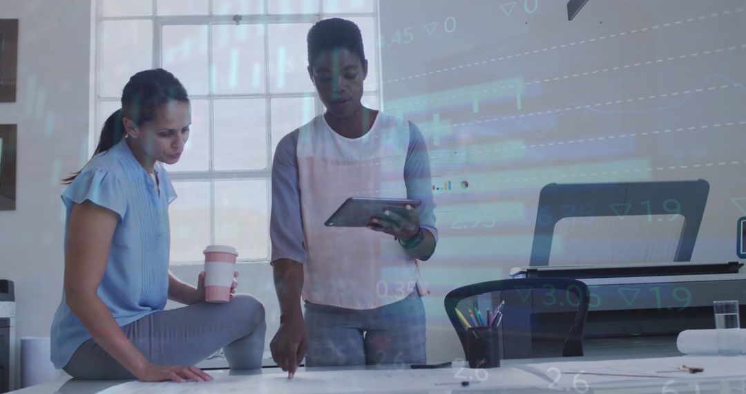 Diverse Women Collaborating on Business Strategy with Data