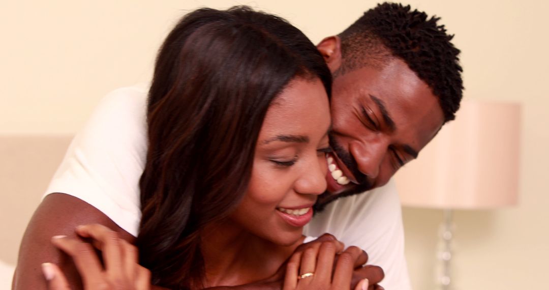 Couple Embracing with Joyful Smiles Radiating Love