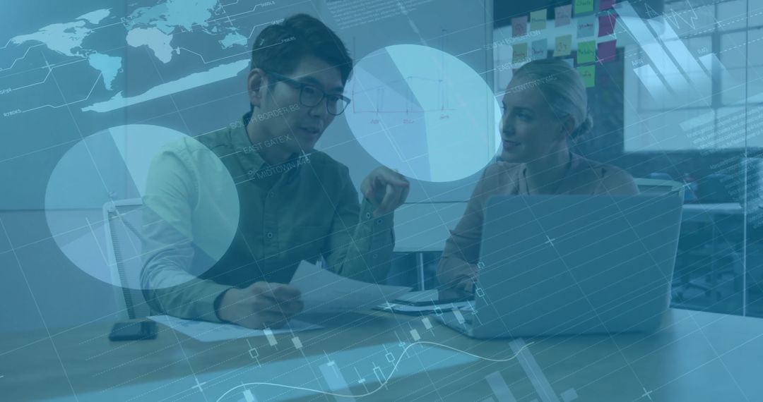 Colleagues Analyzing Business Data in Modern Office