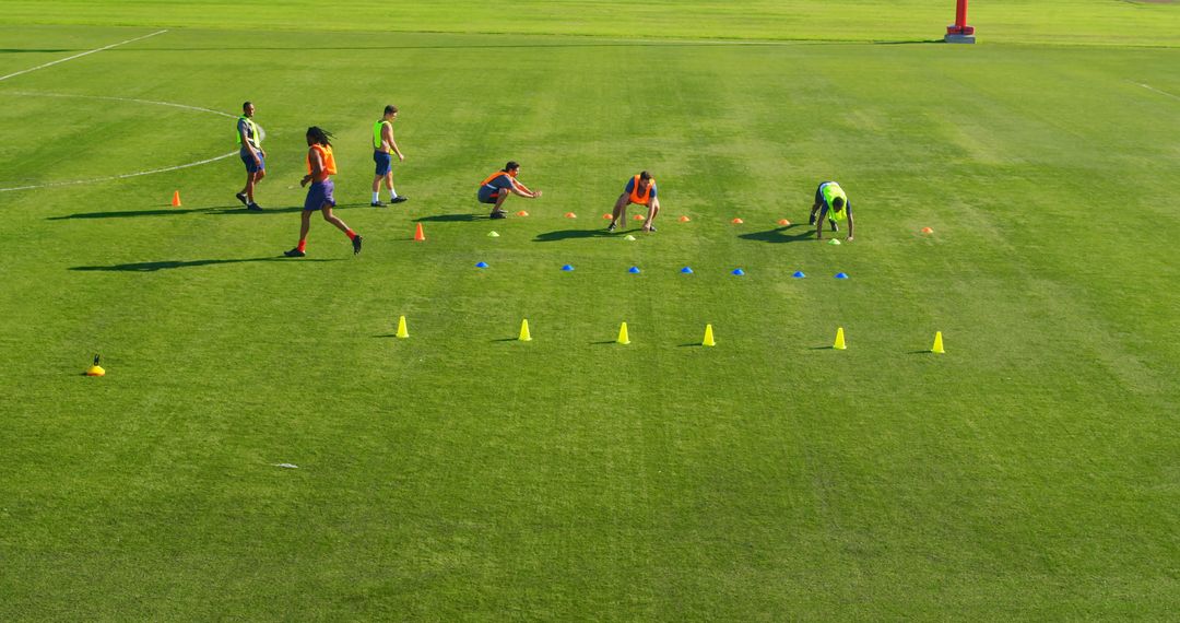 Athletes Enhancing Agility on Sunny Field