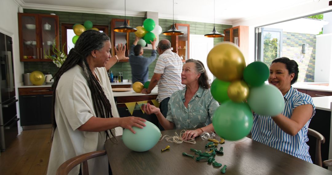 Seniors Decorating for a Party with Balloons in Kitchen