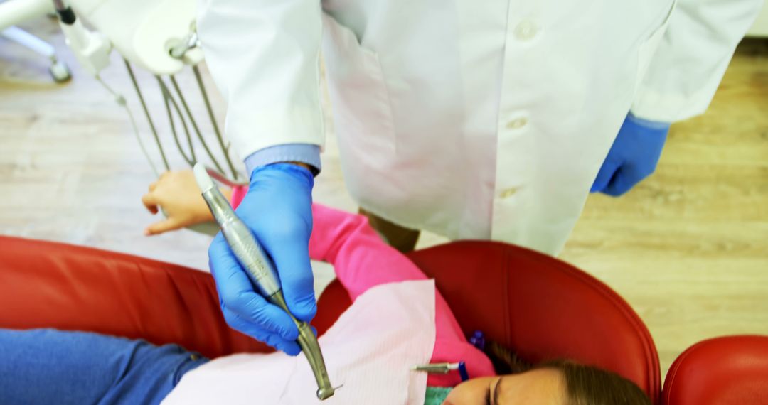 Dentist treating patient in modern clinic - Free Images, Stock Photos and Pictures on Pikwizard.com