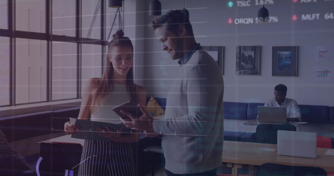 Colleagues Discussing Market Data in Modern Office