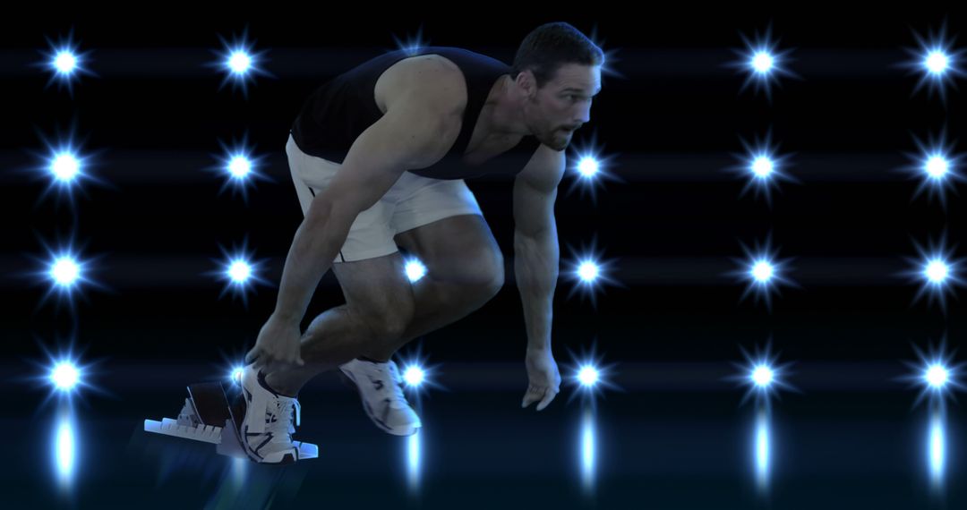 Athlete Preparing to Sprint Under Shimmering Lights