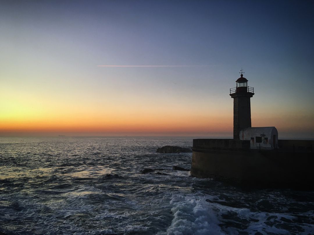 Majestic Lighthouse at Dawn with Ocean View