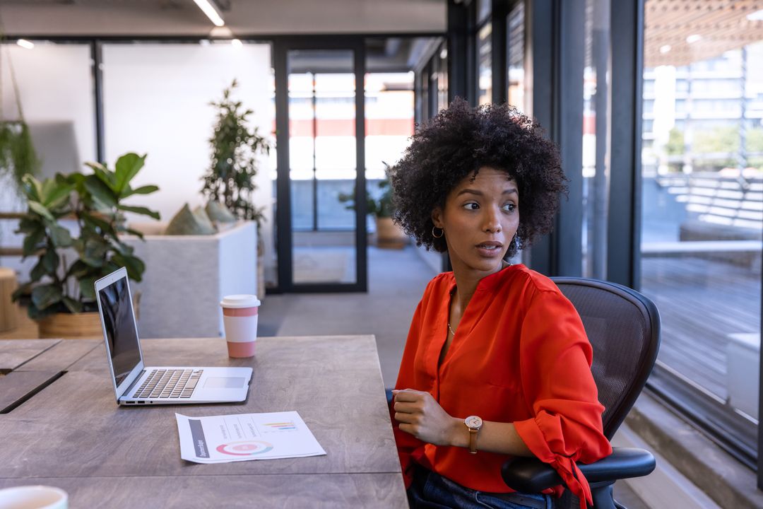 Professional Woman Analyzing Business Data in Modern Office