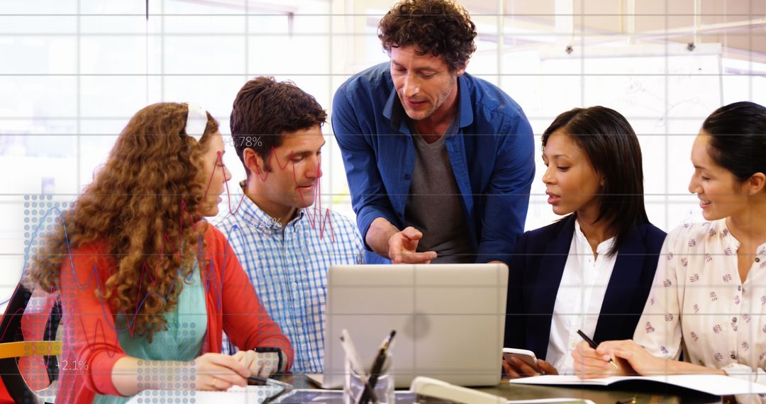 Diverse Business Team Analyzing Data in Office Meeting