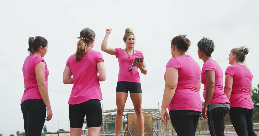 Fitness Instructor Motivating Group of Women in Outdoor Training Session - Free Images, Stock Photos and Pictures on Pikwizard.com