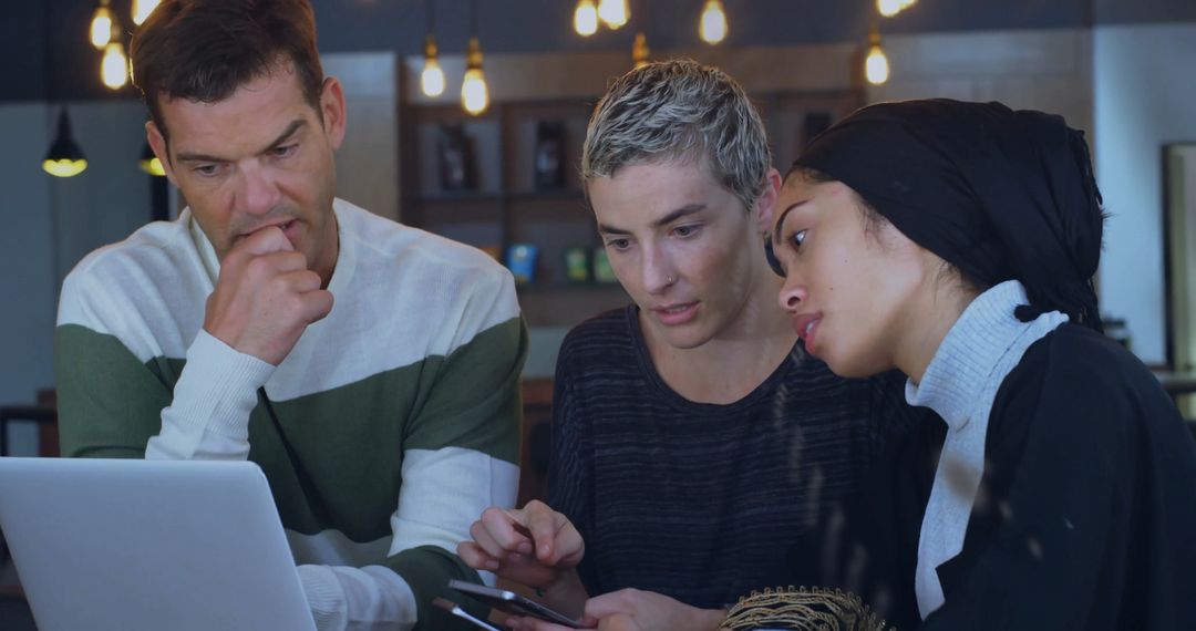 Diverse Team Collaborating in Modern Coffee Shop Environment