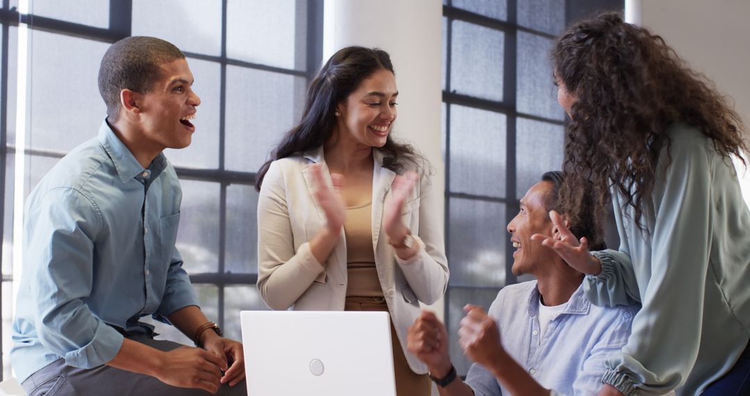Diverse Team Celebrating Office Achievement Together