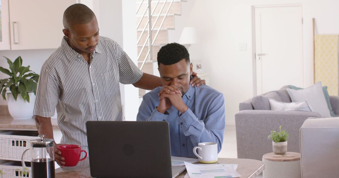 Supportive Friend Comforting Anxious Man at Home Office - Free Images, Stock Photos and Pictures on Pikwizard.com