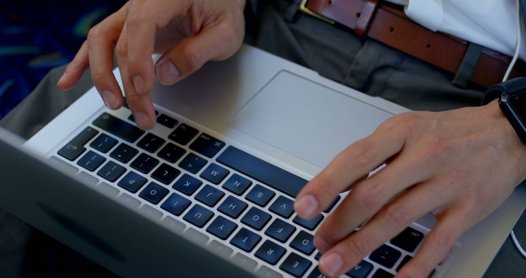 Man Typing on Laptop Keyboard with Smartwatch on Wrist - Free Images, Stock Photos and Pictures on Pikwizard.com